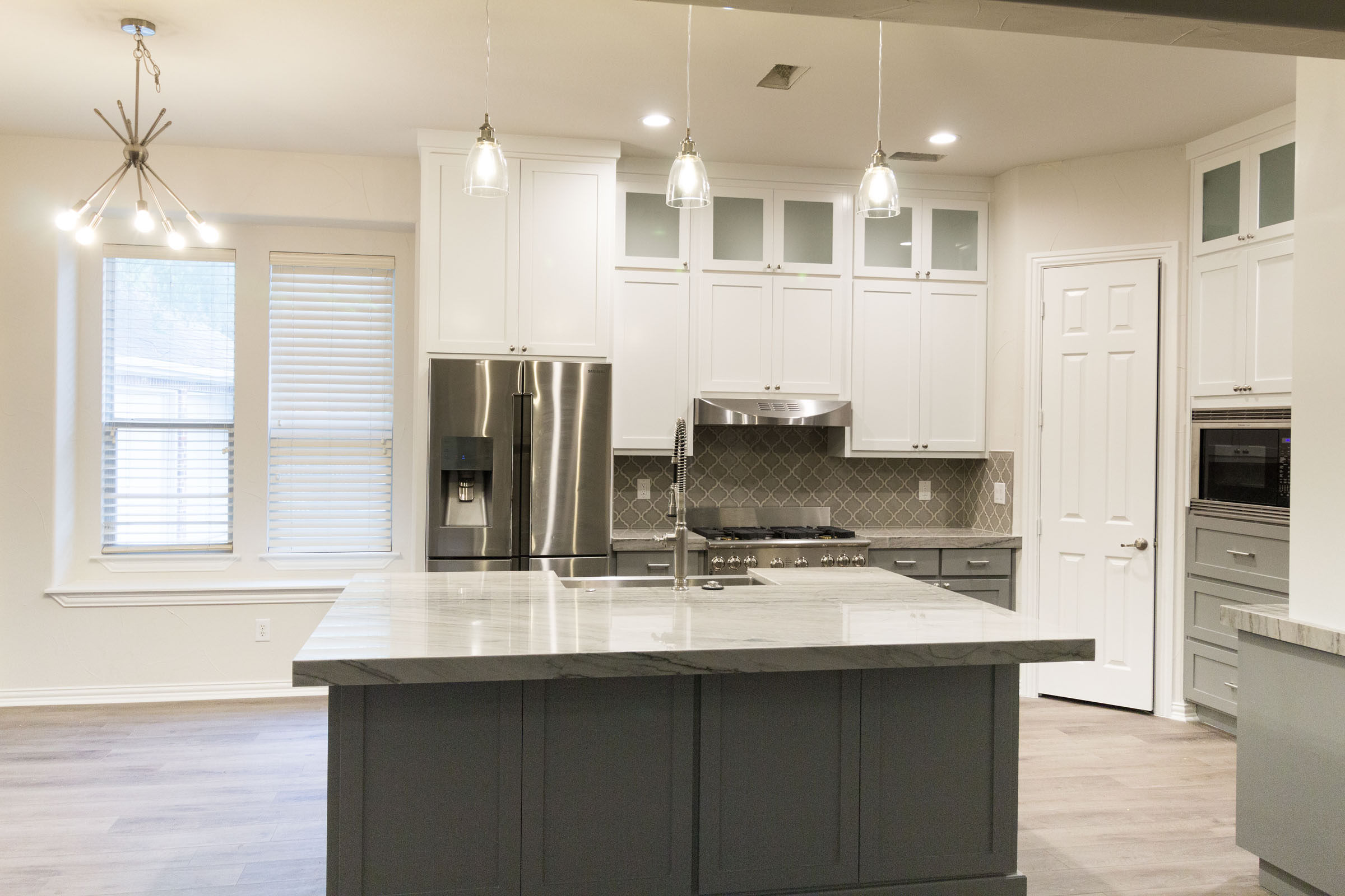 Open floor plan, kitchen remodel, kitchen island, storage and counterspace, white and grey, stunning