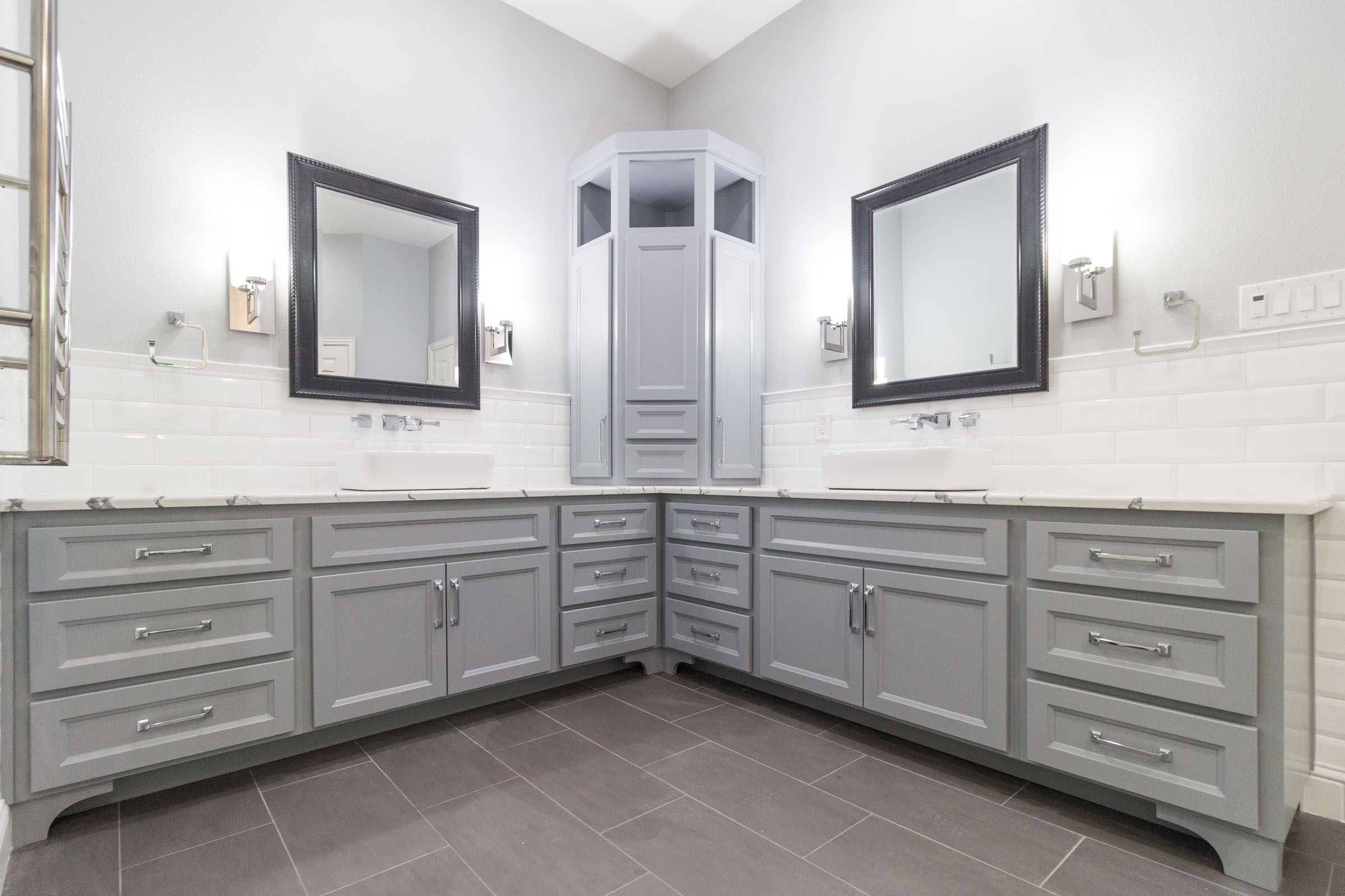 Contemporary bathroom remodel, chrome hardware, white subway tile, grey cabinets, granite countertops, black trimmed mirrors