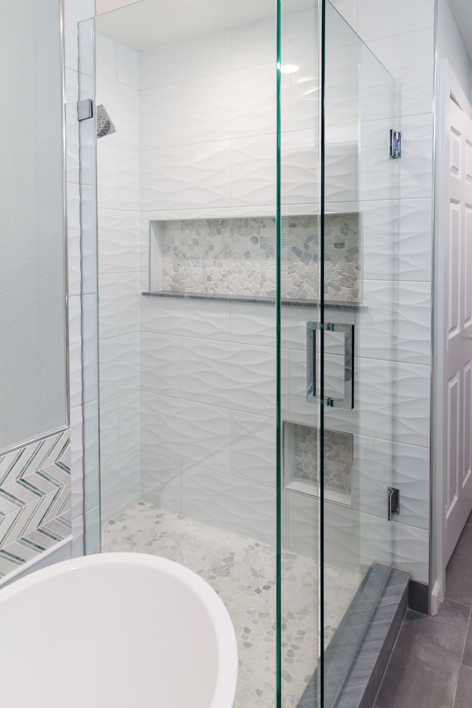 White and grey bathroom remodel, classic tile variations, pedestal tub, walkin shower