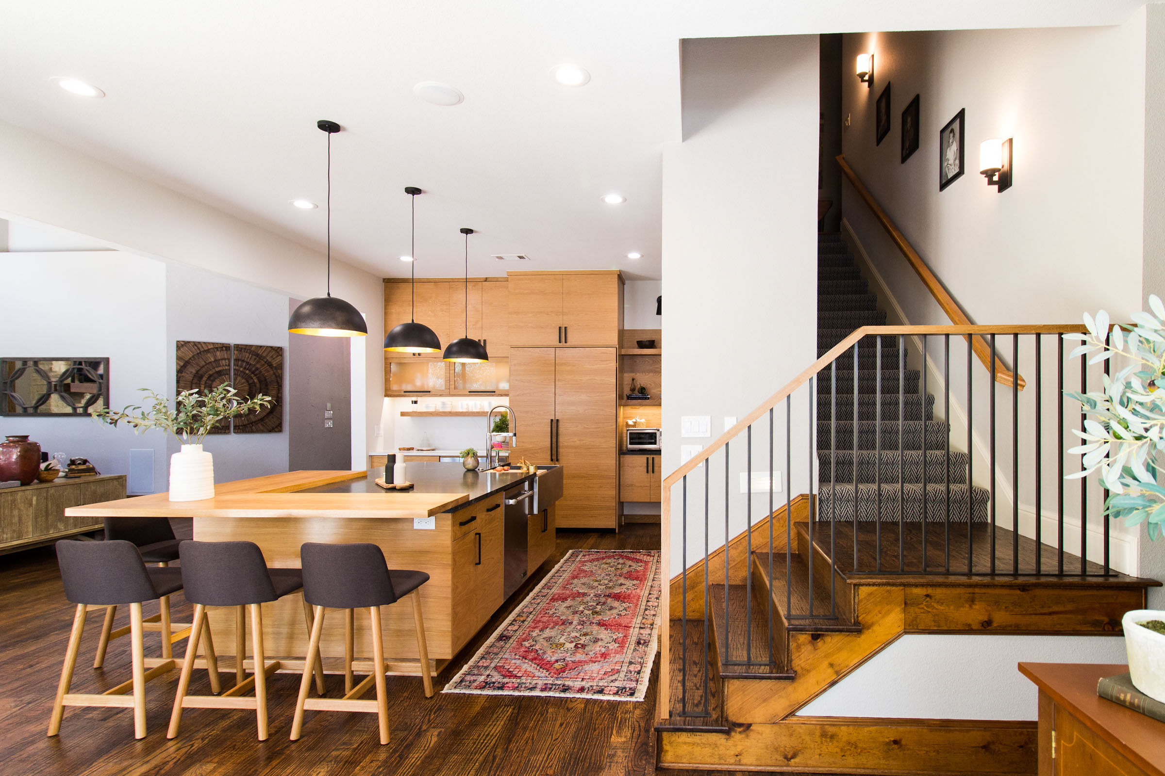 Kitchen remodel with staircase, island, living area, and breakfast nook