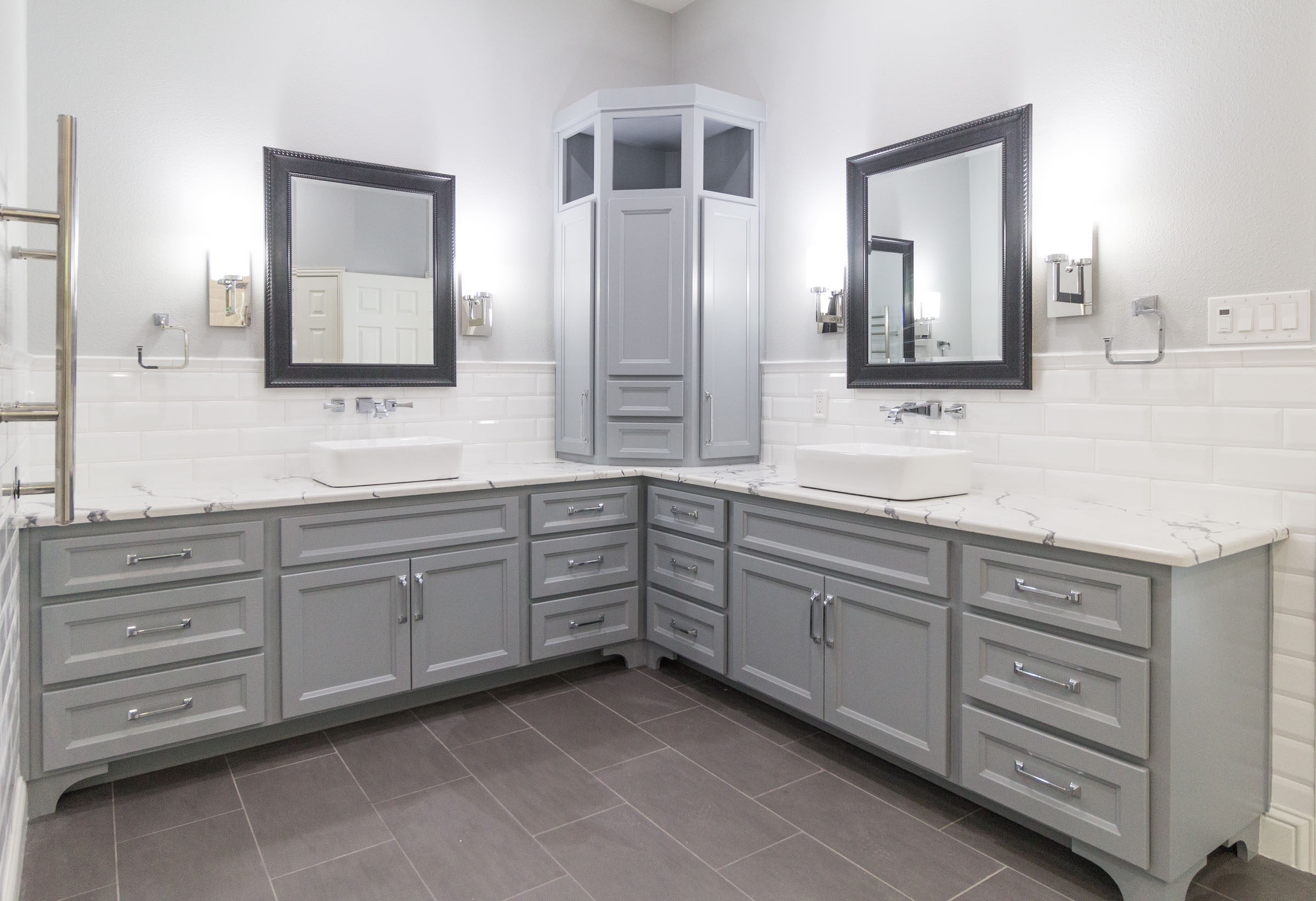 Contemporary bathroom remodel, chrome hardware, white subway tile, grey cabinets, granite countertops, black trimmed mirrors